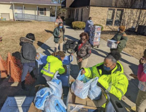 M.C. Dean’s Women in Construction group participating in a holiday community giving event.