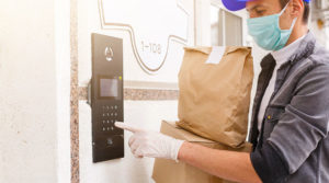 Man delivering groceries during COVID-19 pandemic.